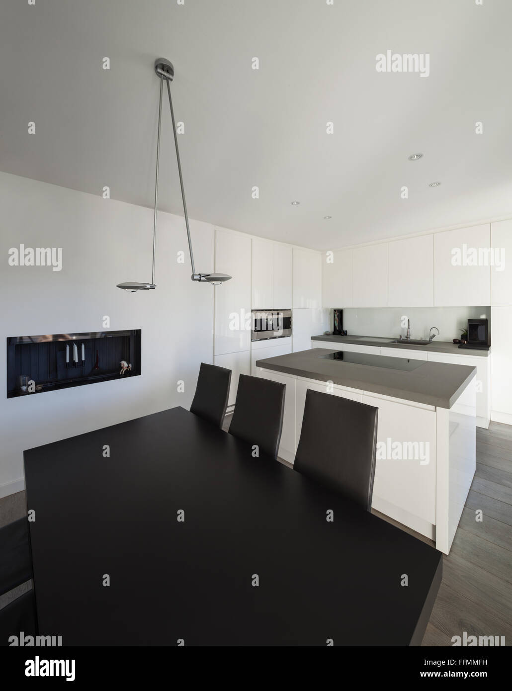 Interior of house, modern kitchen with black dining table Stock Photo ...