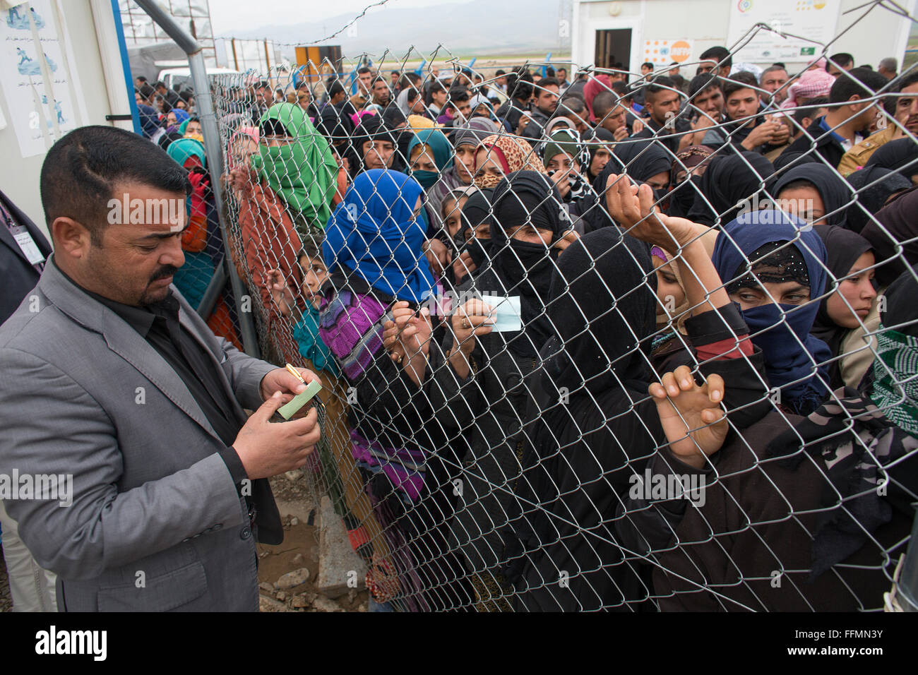 blanket distribution by a Muslim NGO to refugees in Ashdi refugee camp
