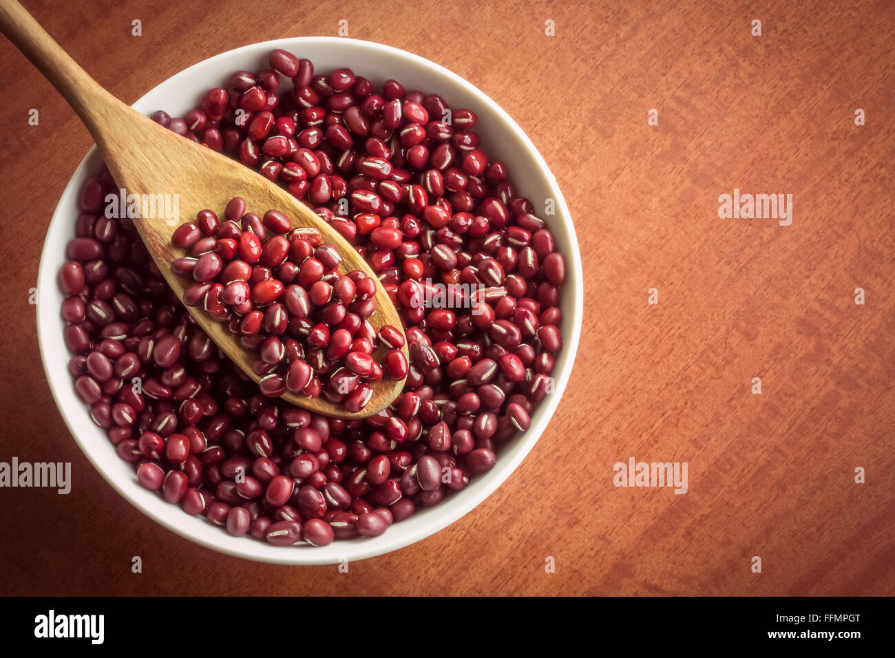 Adzuki beans in white bowl with copy space Stock Photo