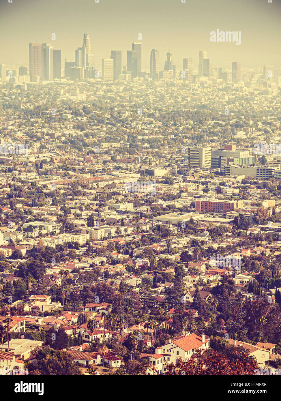 Retro stylized aerial view of Los Angeles seen through smog, USA. Stock Photo