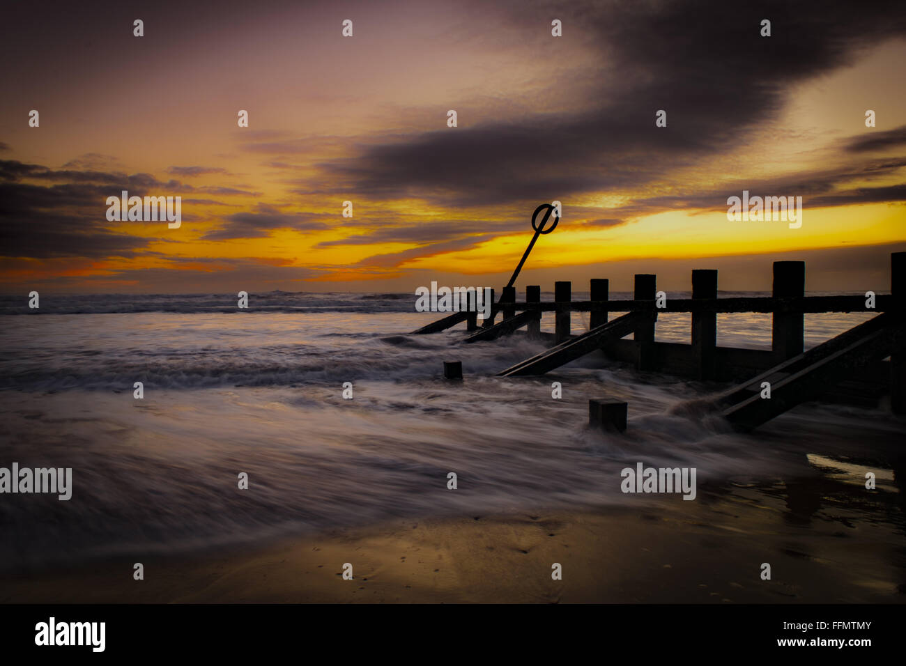 Sunrise over the Groynes Stock Photo - Alamy
