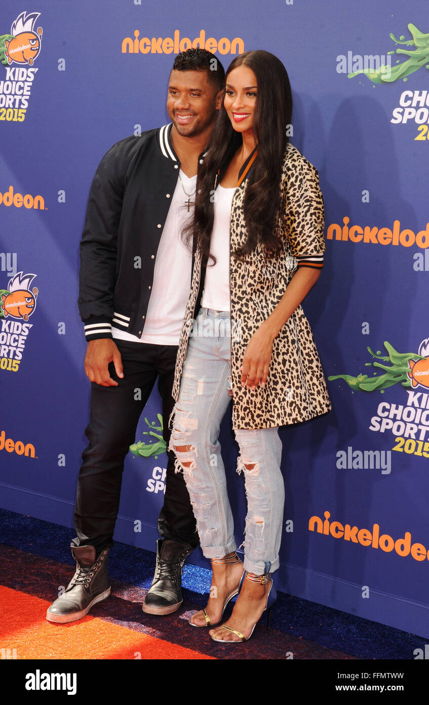 NFL player Russell Wilson (L) and singer Ciara arrive at the Nickelodeon Kids' Choice Sports Awards 2015 at UCLA's Pauley Pavilion on July 16, 2015 in Westwood, California., Stock Photo