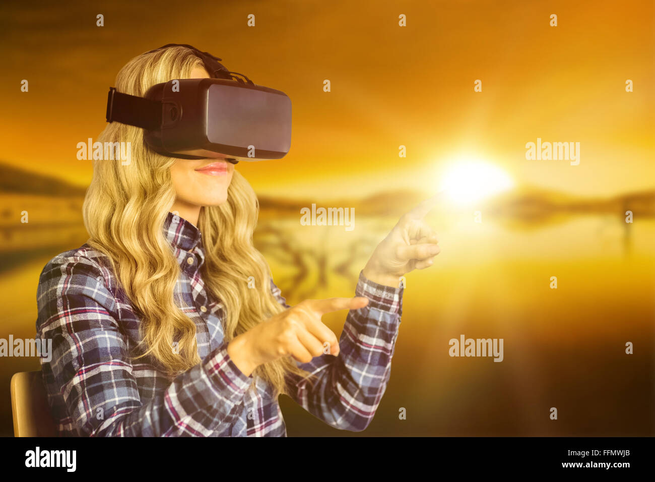Composite image of pretty casual worker using oculus rift Stock Photo