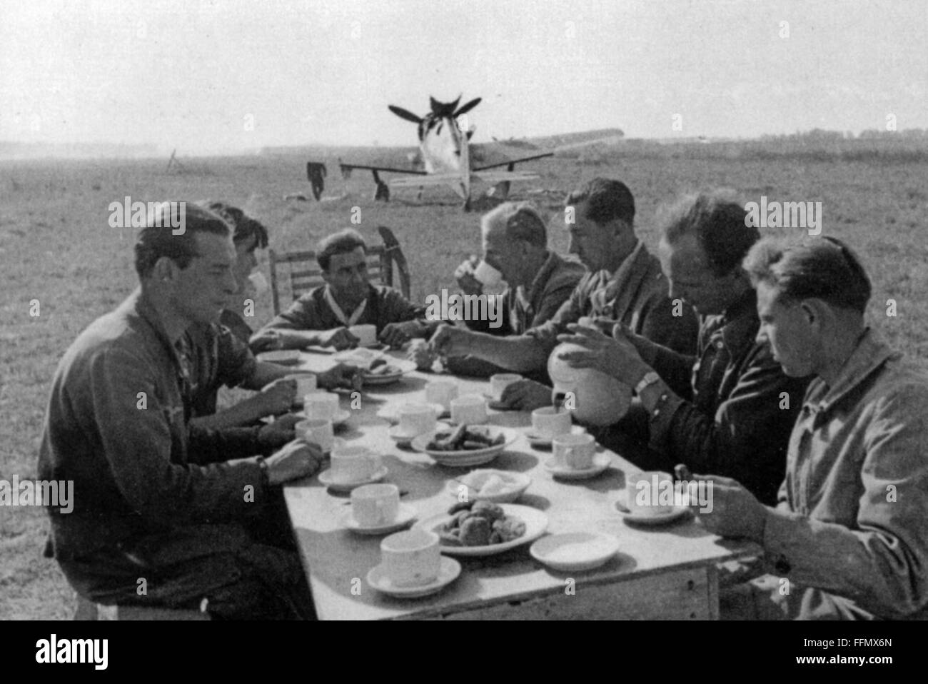 Kittel, Otto 'Bruno', 21.2.1917 - 16.2.1945, German fighter pilot, half length, at the front of the table, as staff sergeant in the Fighter Wing 54, celebration of the bestowal of the Knight's Cross, air base Vitebsk, Belarus, 29.10.1943, Stock Photo