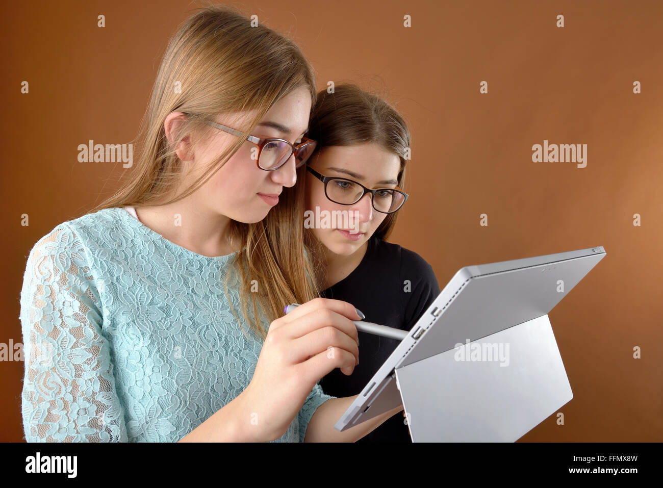 two young teenage girls with a tablet Stock Photo