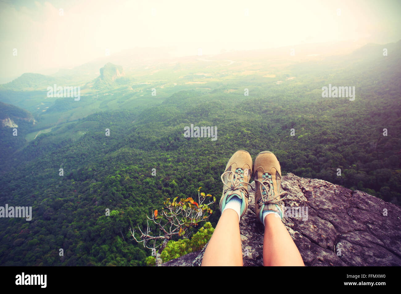 young woman hiker legs sit on mountain peak cliff Stock Photo - Alamy