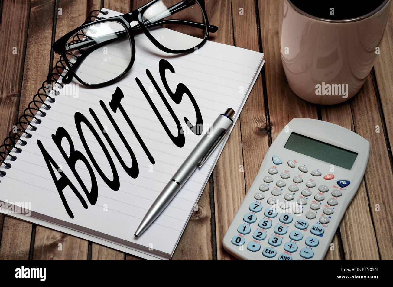 About us word on notepad Stock Photo - Alamy