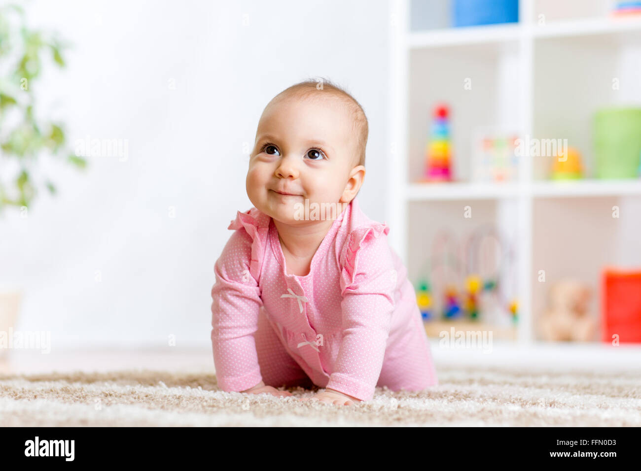 crawling funny baby indoors at home Stock Photo