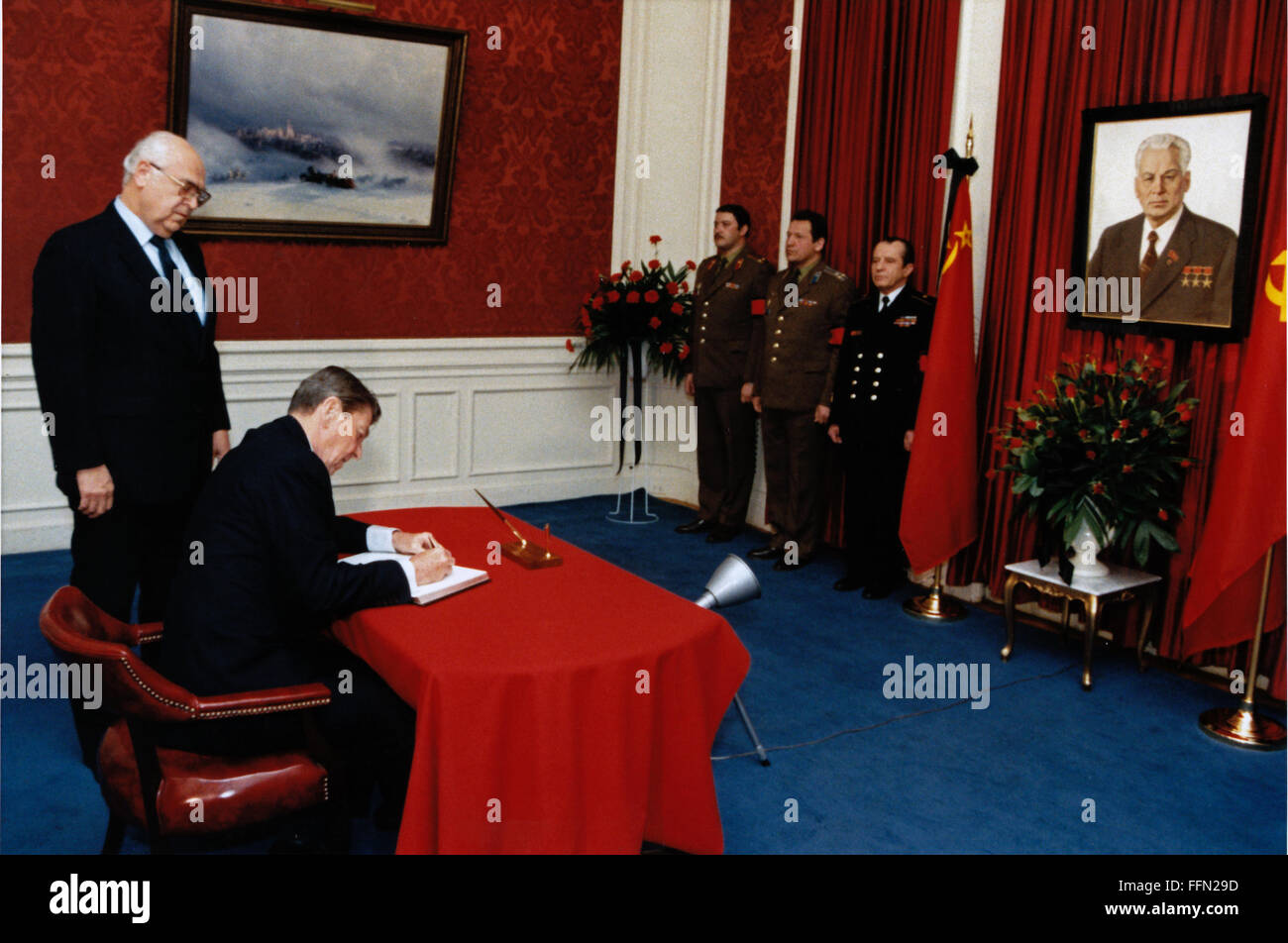 Washington, District of Columbia, USA. 12th Jan, 2010. United States President Ronald Reagan signs a condolence book for the late leader of the Soviet Union, Konstantin Chernenko, as Ambassador Anatoly Fyodorovich Dobrynin of the Soviet Union looks on. The President visited the Soviet Embassy in Washington, DC on Monday, March 11, 1985.Mandatory Credit: Michael Evans - White House via CNP © Michael Evans/CNP/ZUMA Wire/Alamy Live News Stock Photo