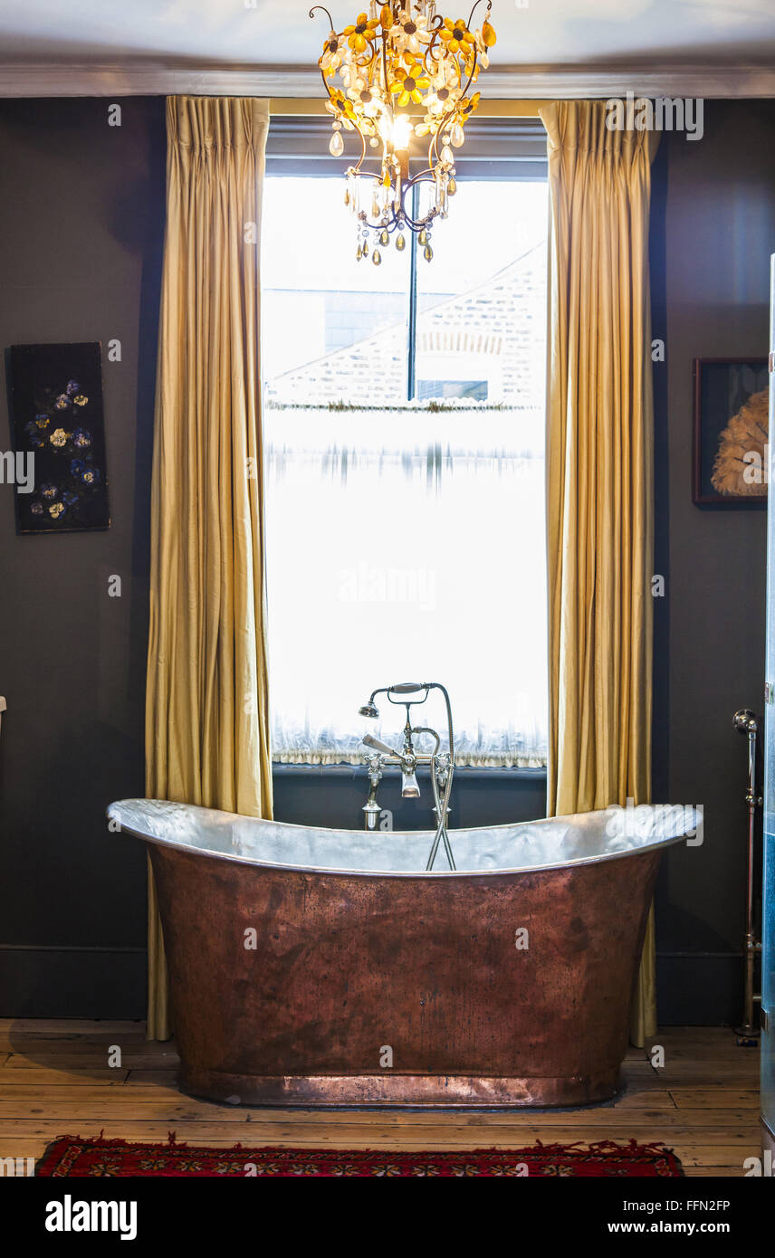 Artist Alice Instone's house in Clapham, London. The copper bath in the ...