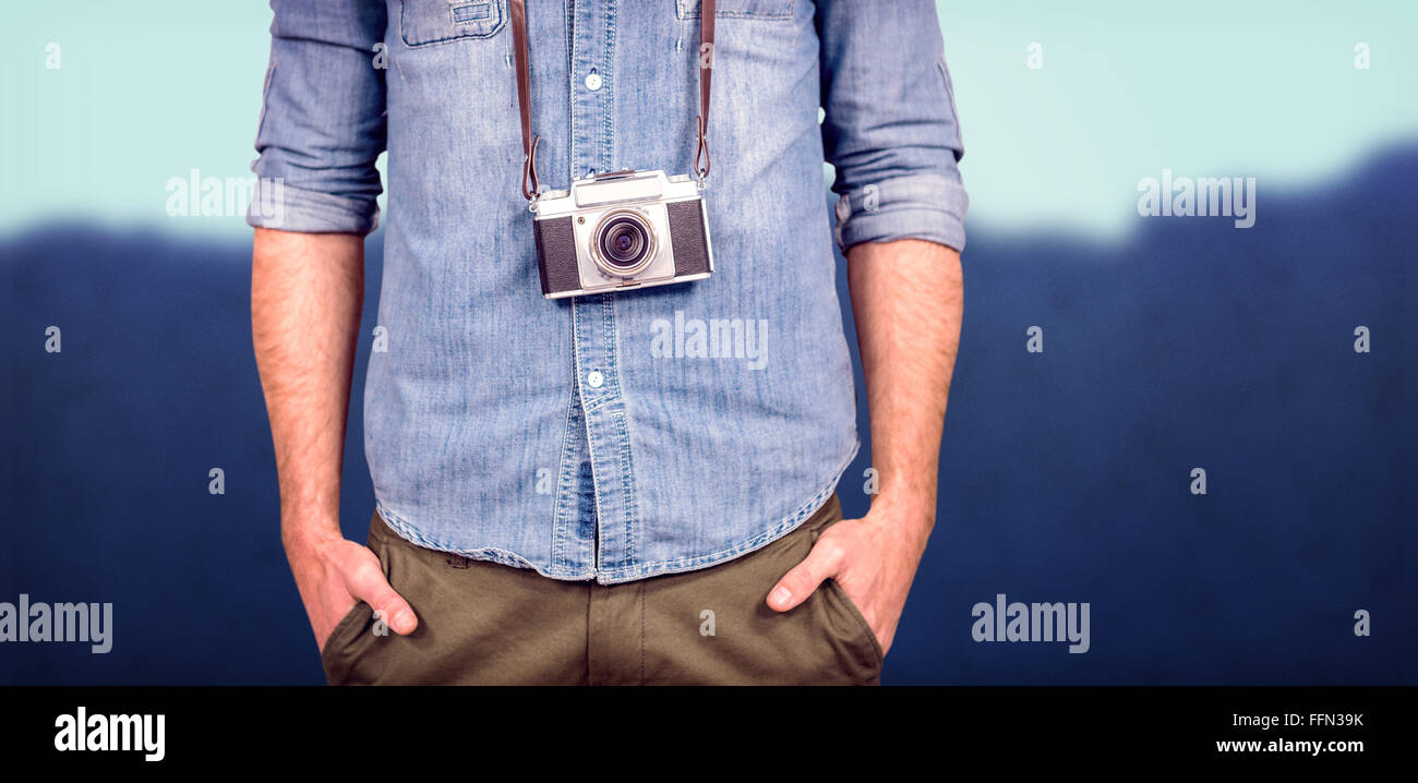 Composite image of hipster man holding digital camera Stock Photo