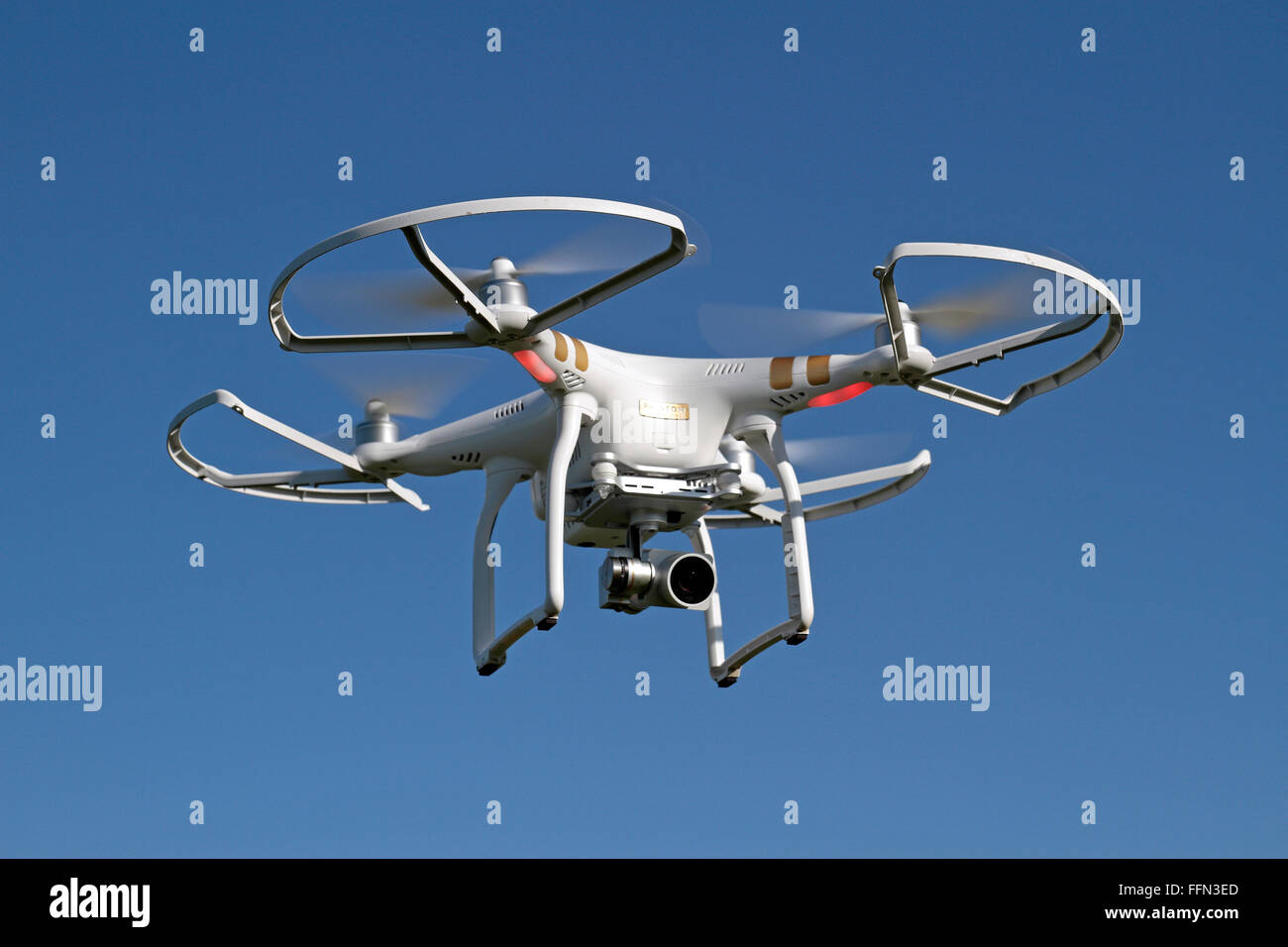 A DJI Phantom 3 Professional quadcopter (or drone) with safety prop guards  attached Stock Photo - Alamy