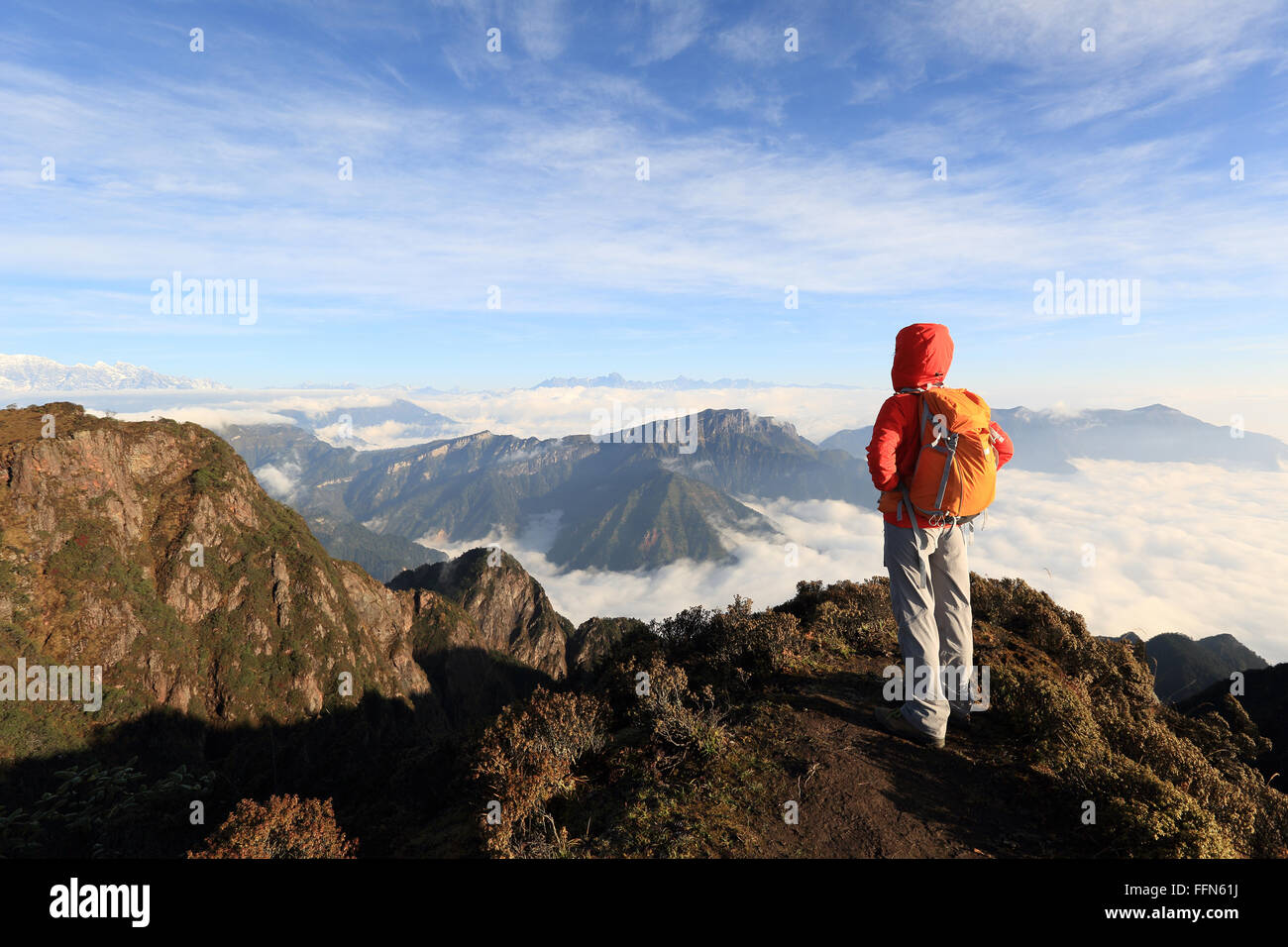 young woman backpacker hiking at mountain peak Stock Photo - Alamy