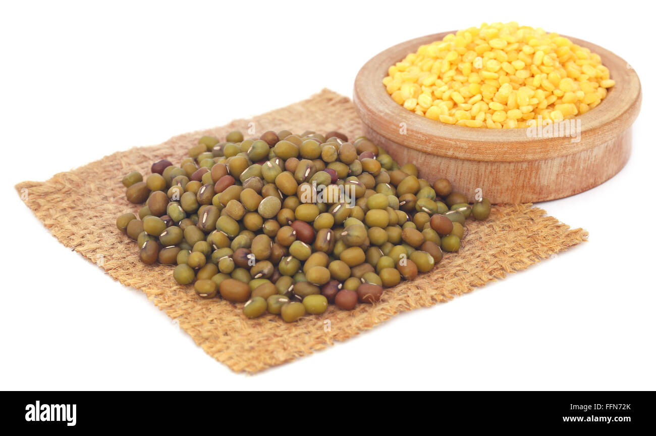 Mung bean in jute bag and bowl over white background Stock Photo