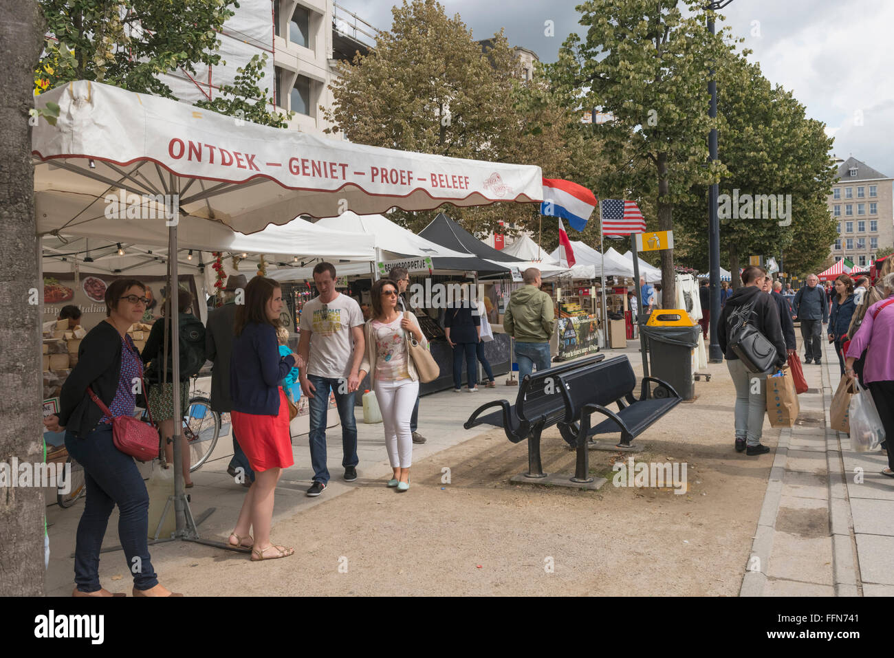 Street Market in Ghent old town, Belgium, Europe with food market stalls, shoppers and tourists Stock Photo