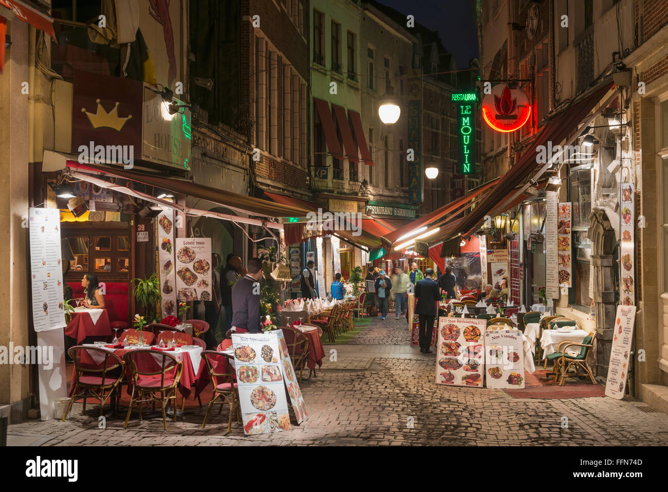 Restaurants in Brussels city at night - Rue des Bouchers, Brussels, Belgium, Europe Stock Photo