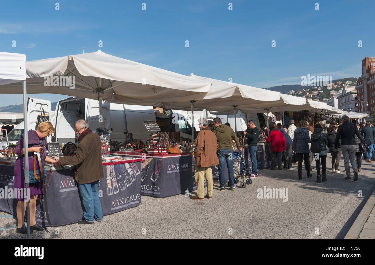 Sunday Trieste market stalls on the waterfront in Trieste, Italy, Europe Stock Photo