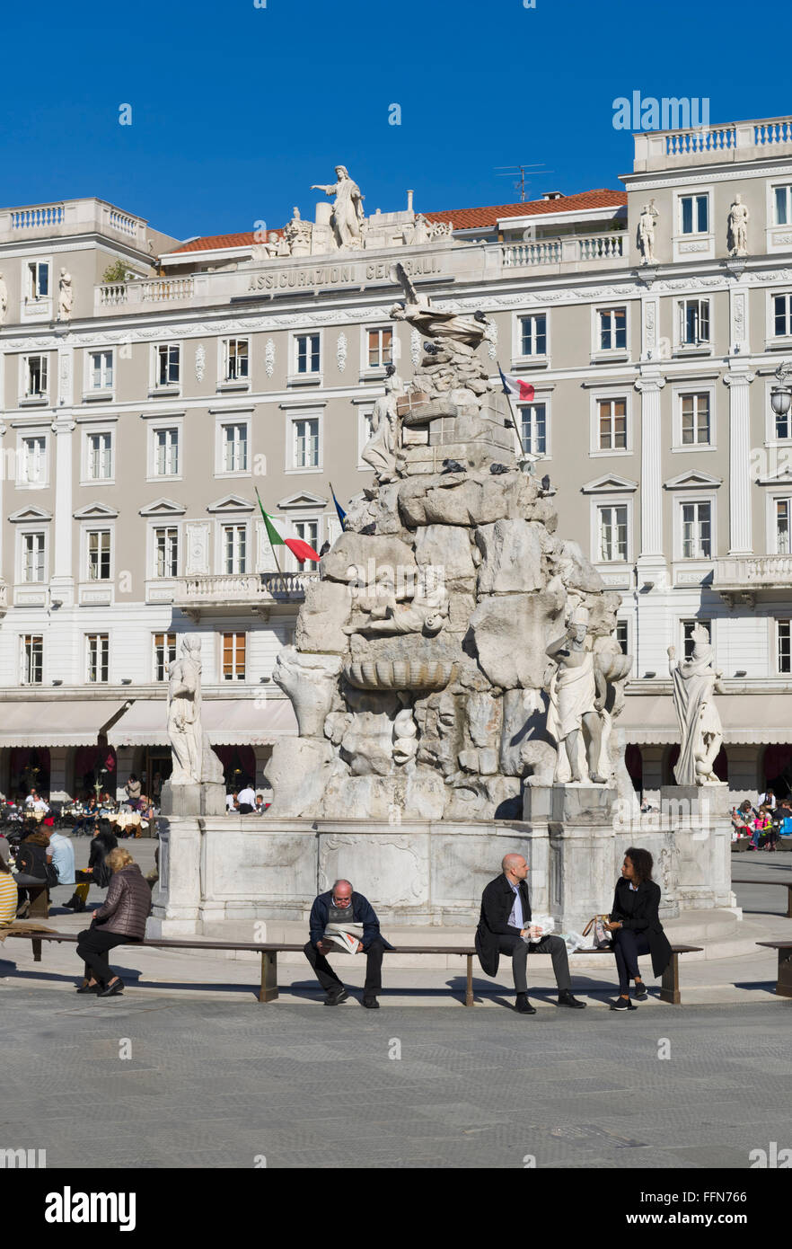Tourists at the fountain in Piazza Unita d'Italia square, Trieste, Italy, Europe Stock Photo
