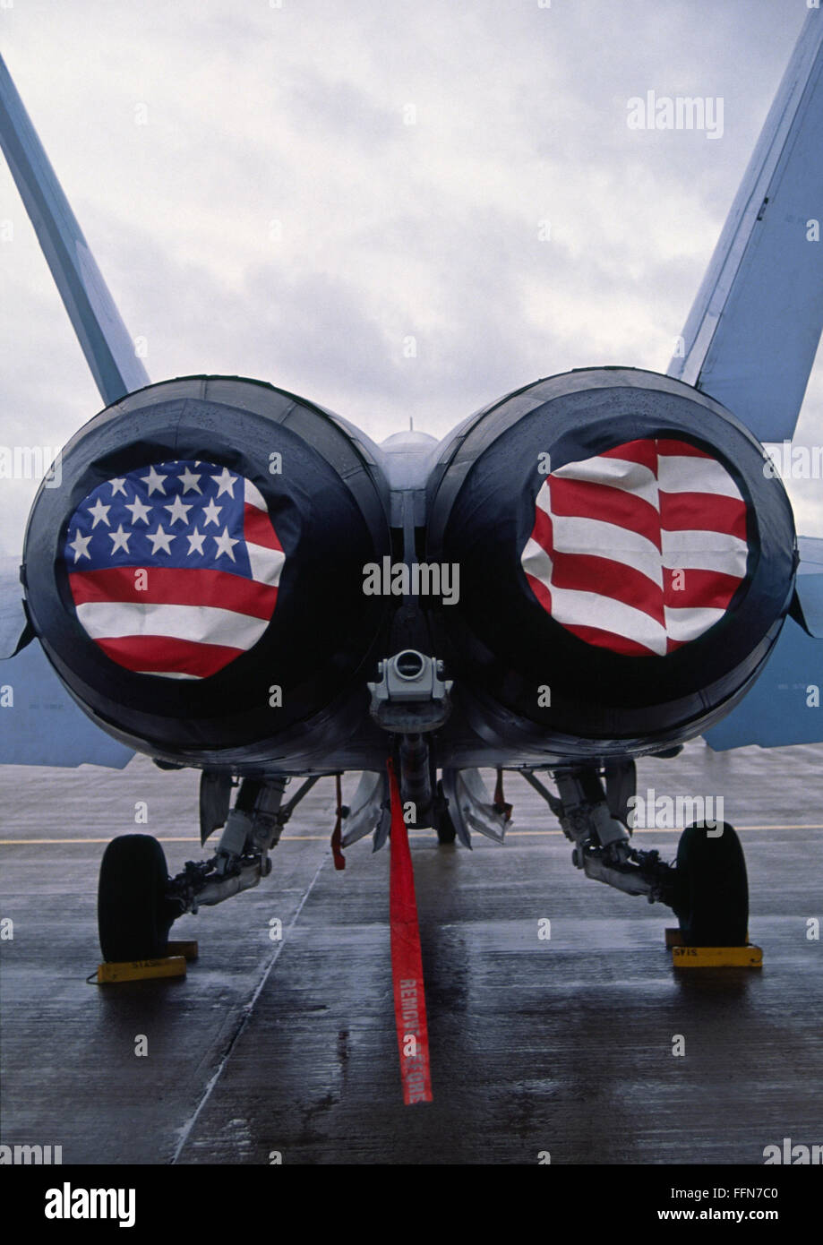 Patriotic American Flag covers on the rear of a USA F/A-18 Hornet fighter combat jet aircraft. Stock Photo