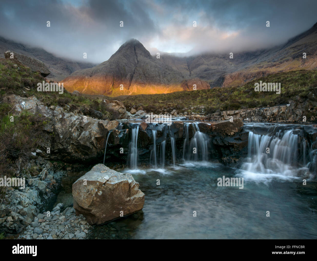strange presence spooky shaft of golden light at the fairy pools Stock Photo