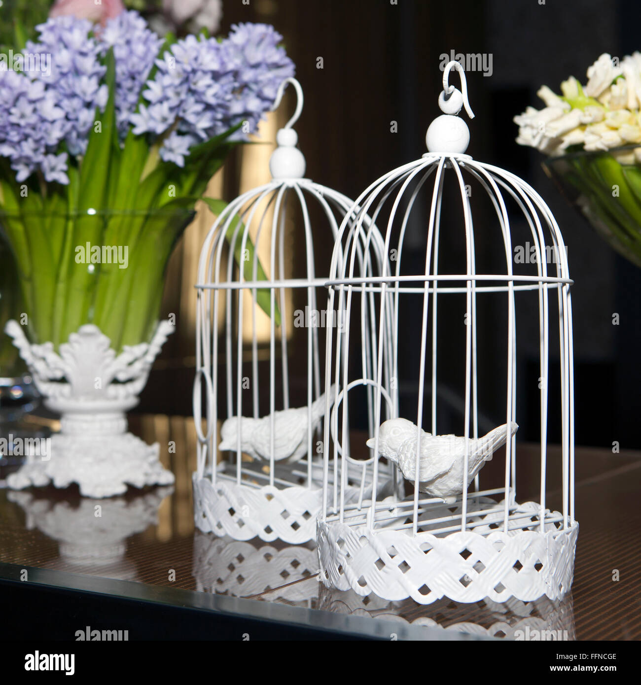 Easter decoration with cage, birds and flowers Stock Photo