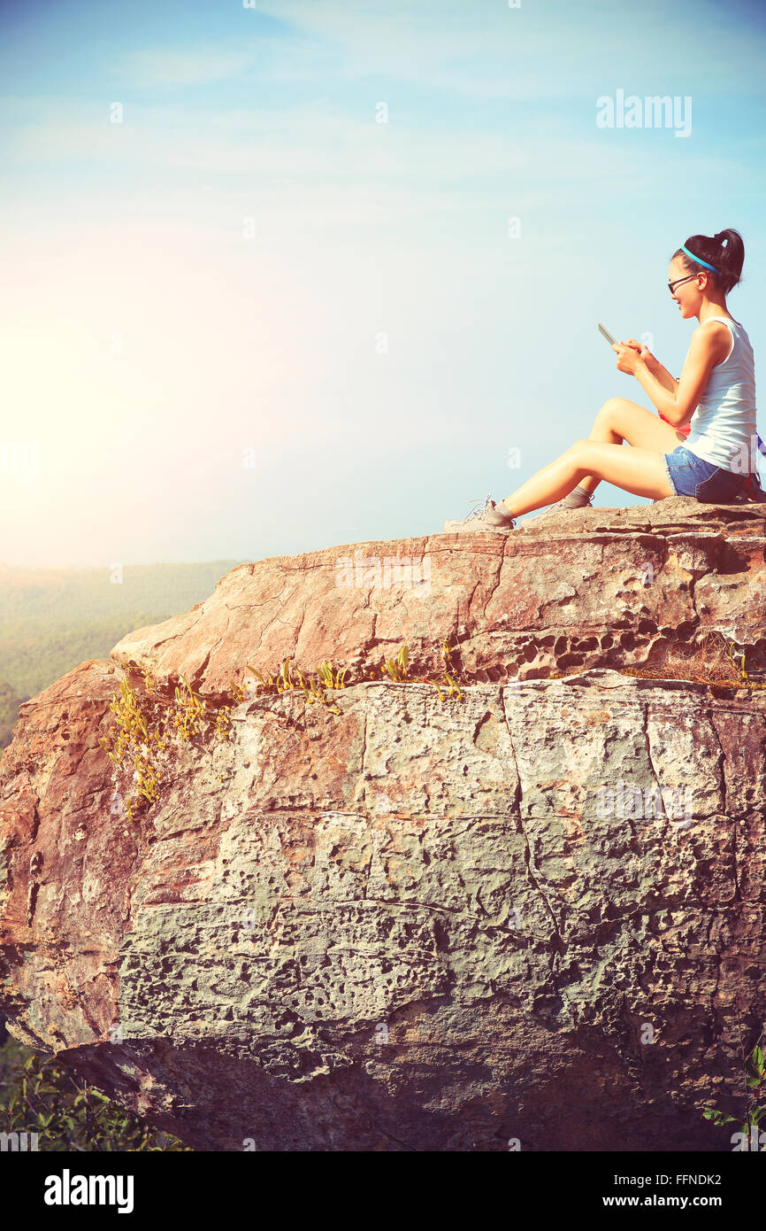 young woman hiker use digital tablet at mountain peak Stock Photo - Alamy