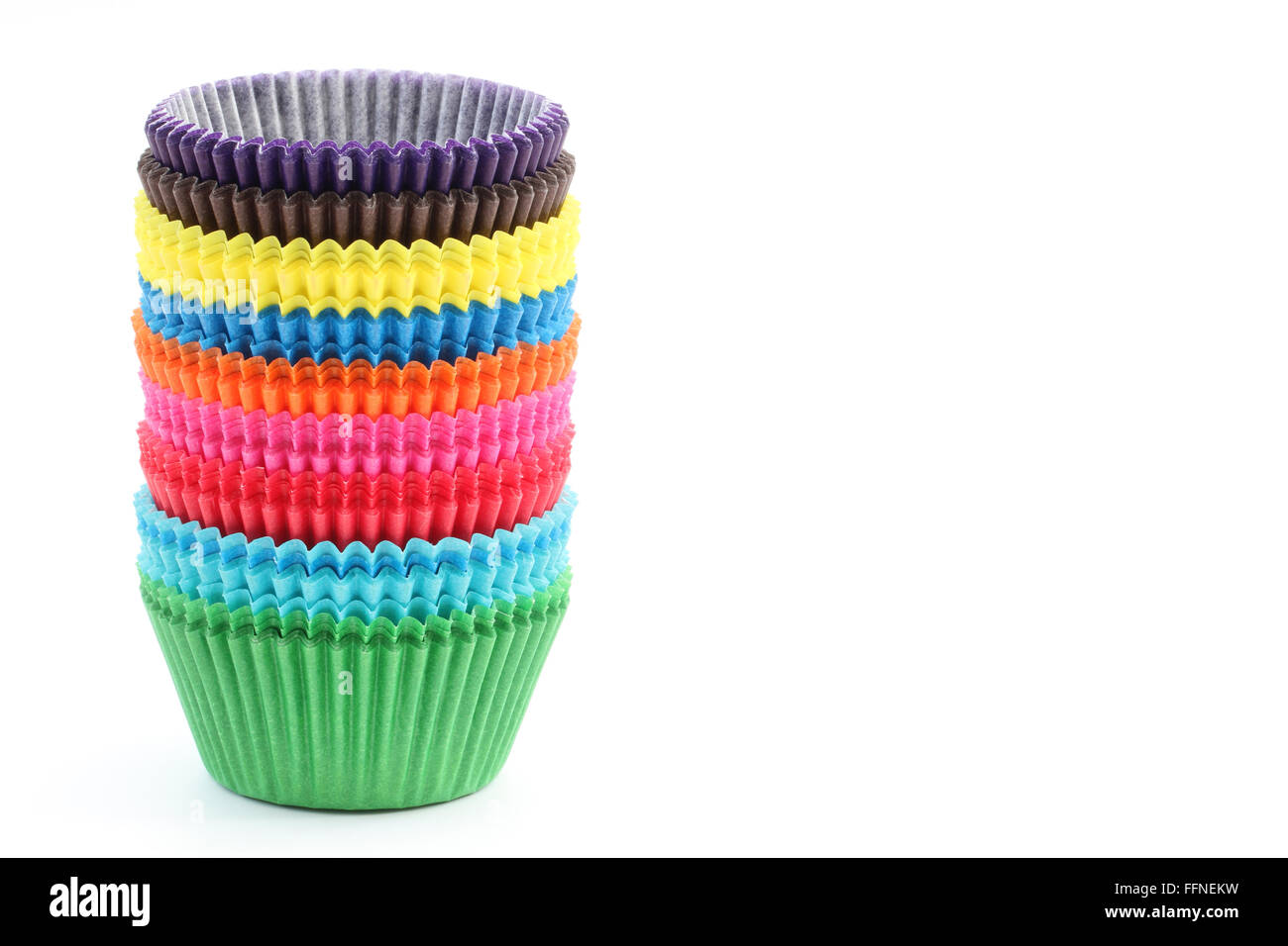 A stack of colorful baking cases on an isolated white background. Stock Photo
