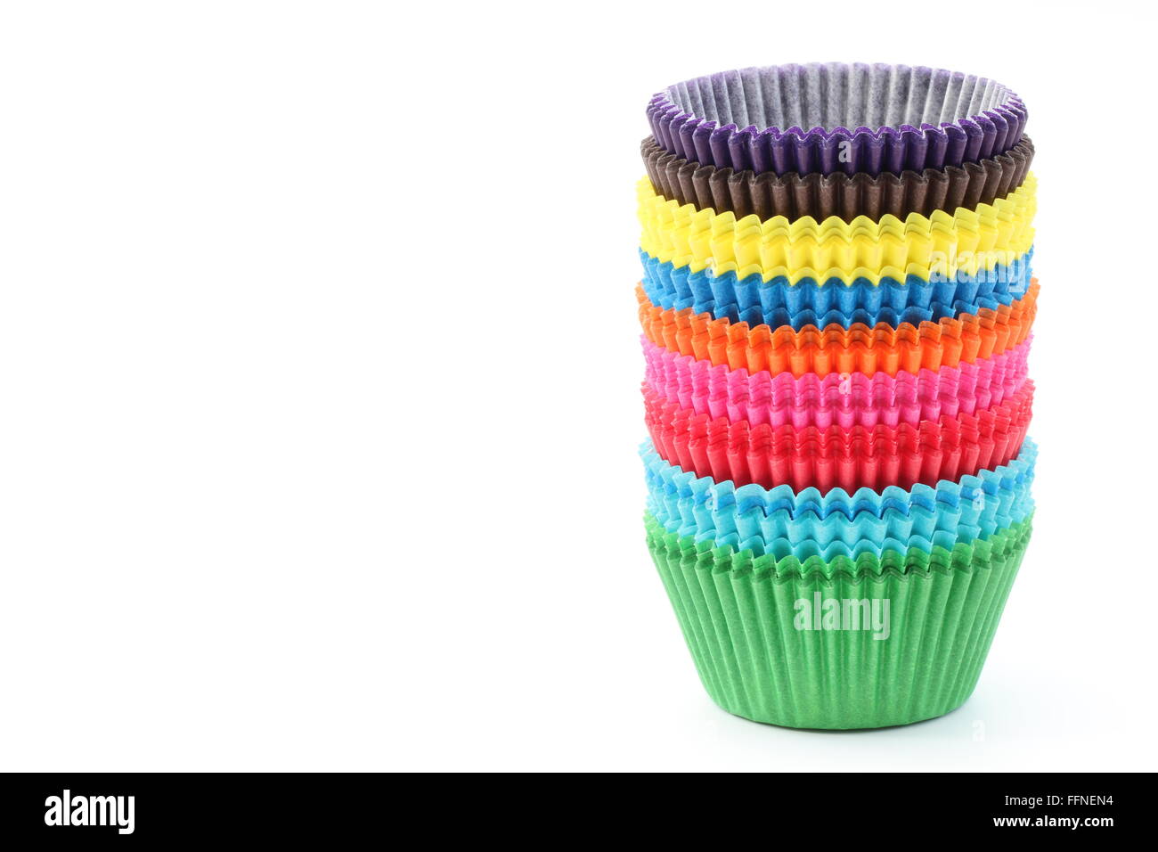 A stack of colorful baking cases on an isolated white background. Stock Photo
