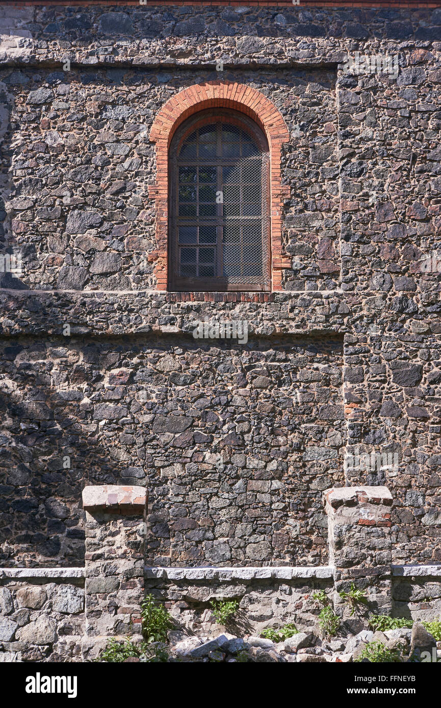 Window on medieval stone wall of the church in Poland Stock Photo - Alamy