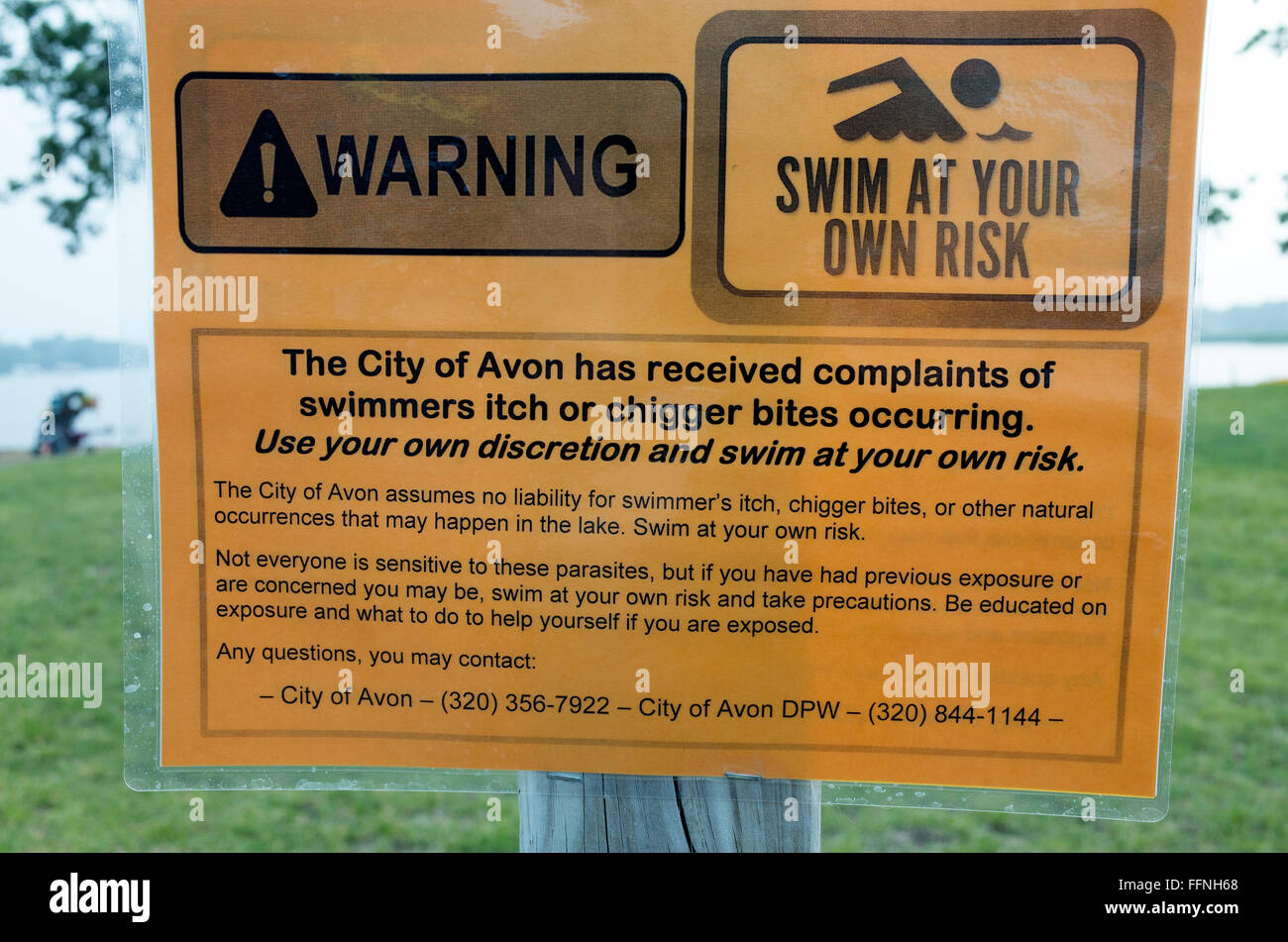 Warning sign for swimmers itch and chigger bites from swimming in Middle Spunk Lake. Avon Minnesota MN USA Stock Photo