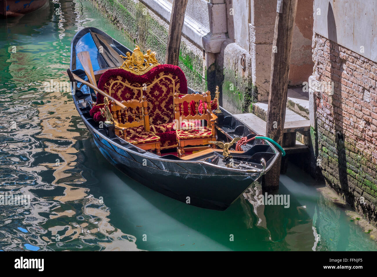 Small Gondola Type Boat Moored On A Canal Venice Italy Stock Photo Alamy