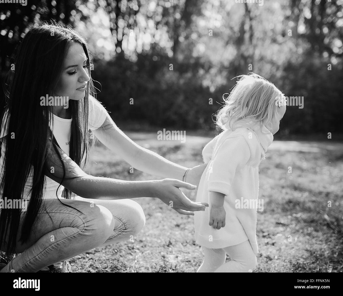 young family walking in the park Stock Photo