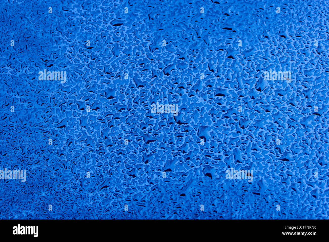 Waterdrops on blue car paint as background Stock Photo