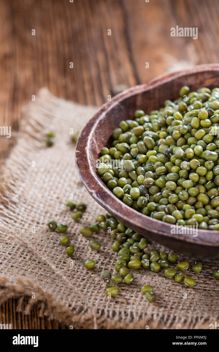 Dried Mung Beans (detailed closeup shot) on vintage wooden background