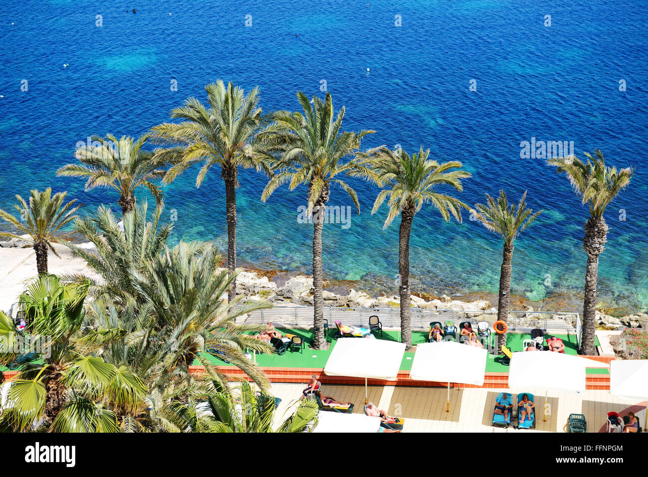 The tourists are on vacation at popular hotel, Bugibba, Malta Stock Photo