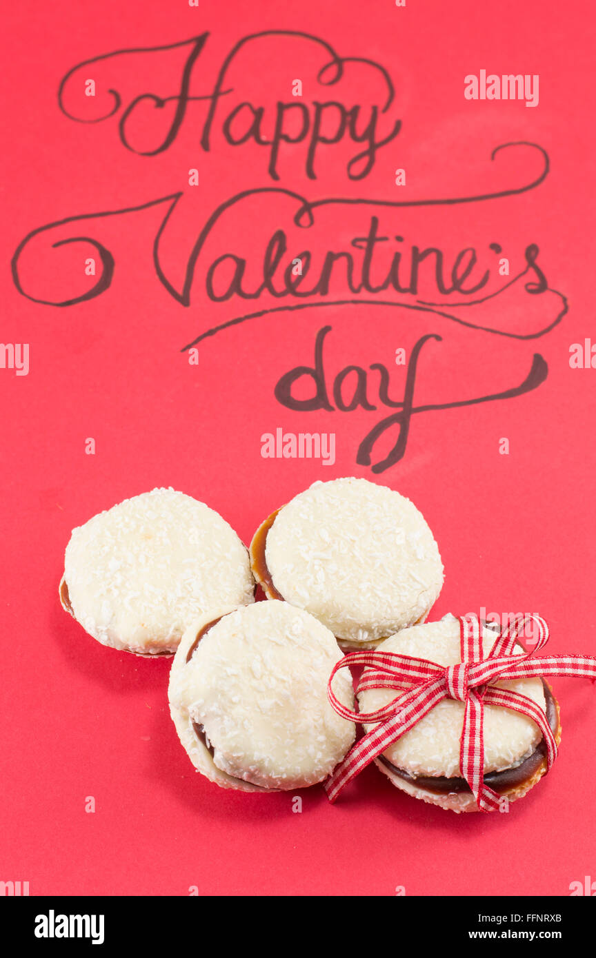 Red Valentine's day card and homemade cookies Stock Photo