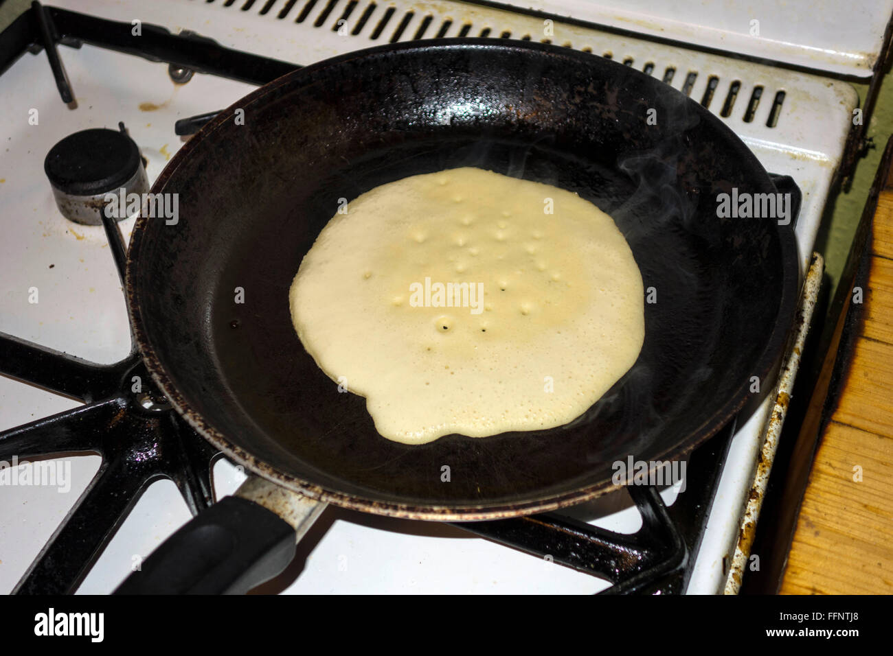 Making pancakes on a gas stove Stock Photo Alamy
