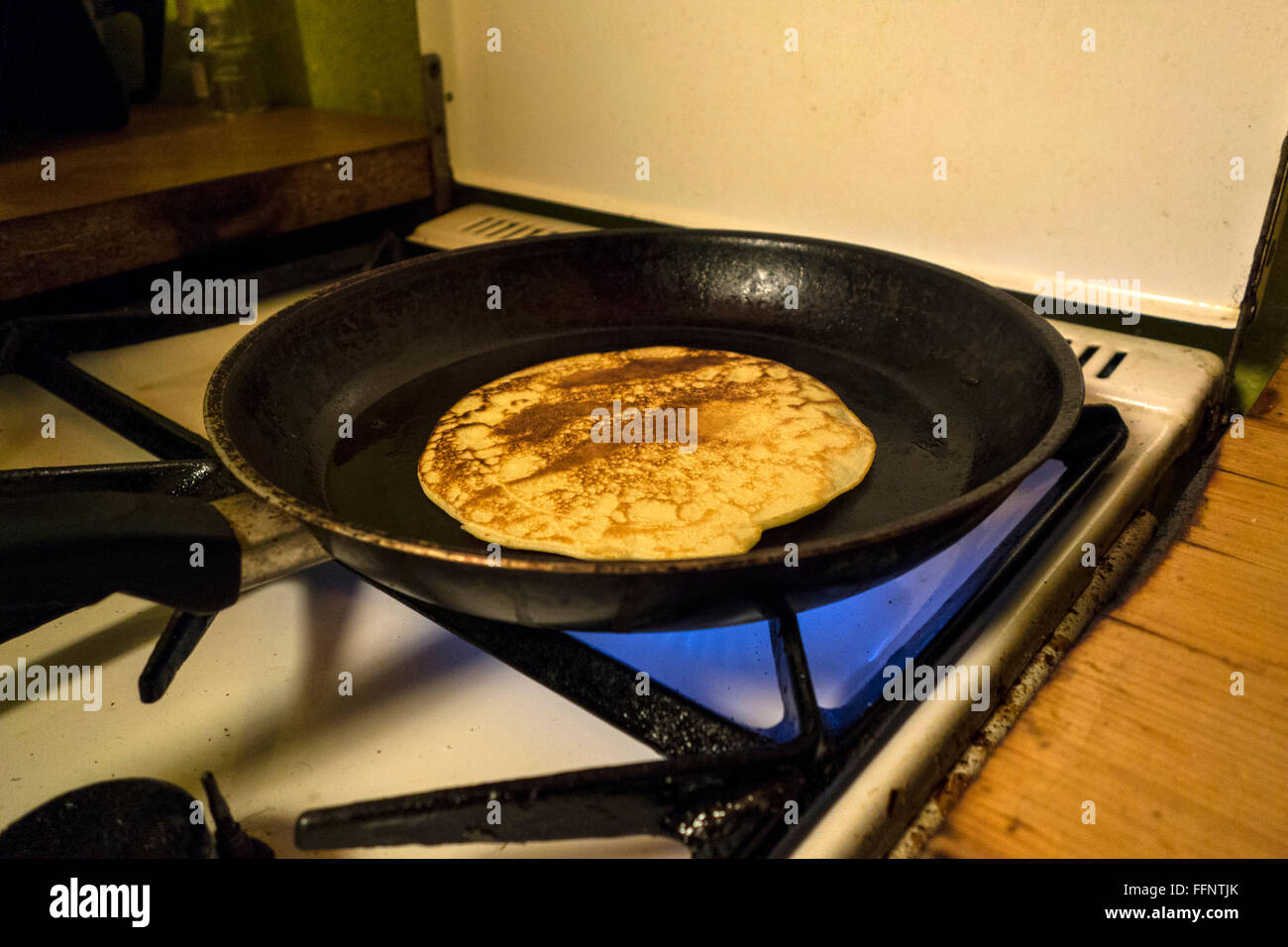 Making pancakes on a gas stove Stock Photo Alamy