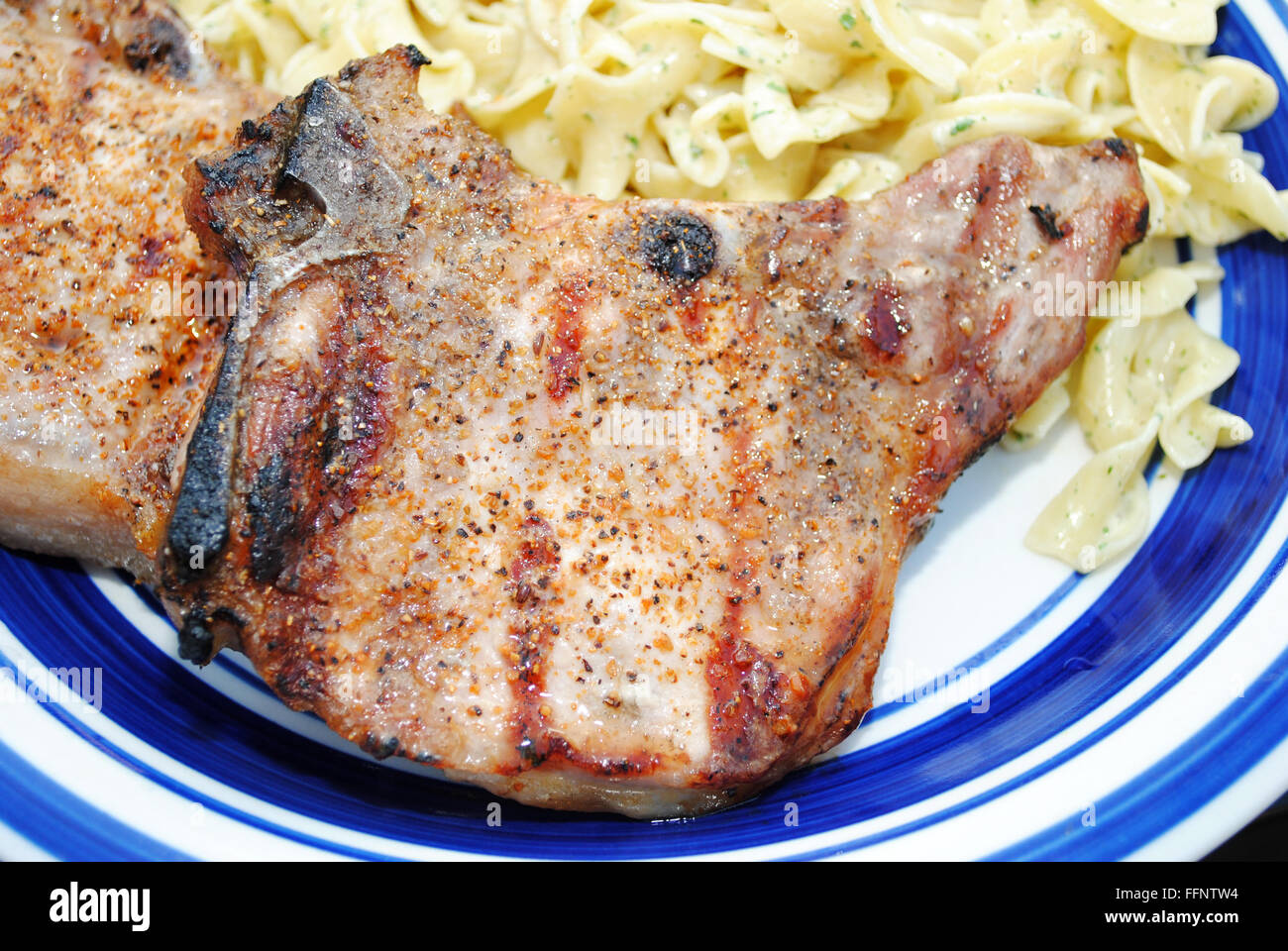A Served Grilled Pork Chop Stock Photo