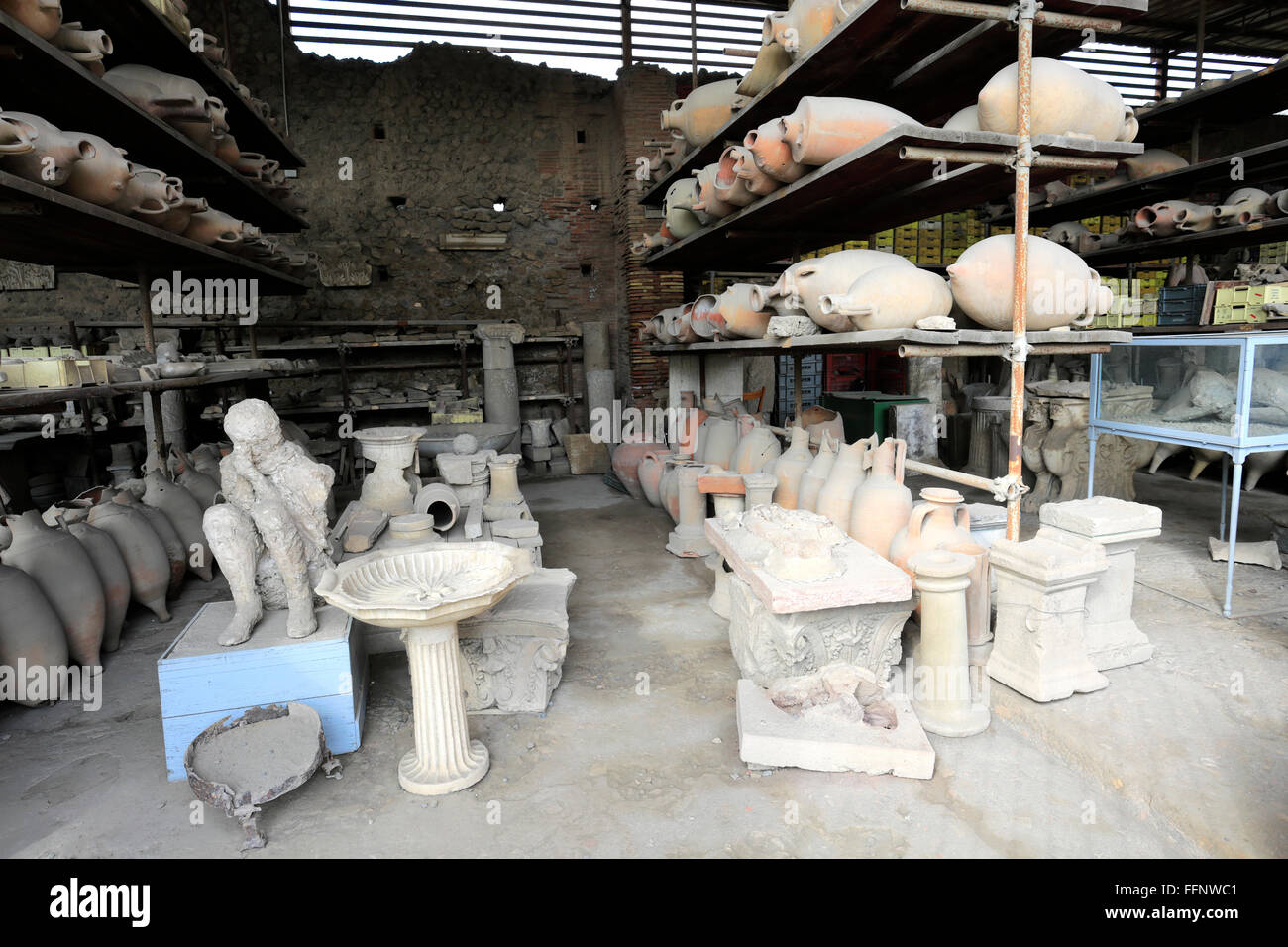 Stored artifacts in the Granai del Foro, Forum Granary, Pompeii, the Roman city buried in lava near Naples city, UNESCO World Stock Photo