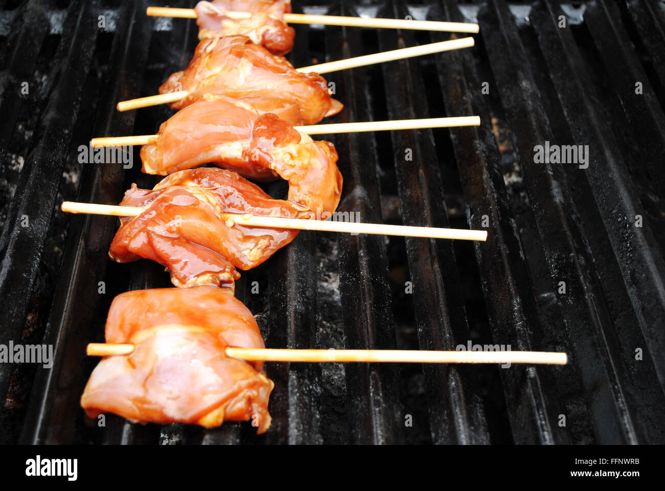 Grilling Teriyaki Marinated Chicken on a Stick Stock Photo Alamy