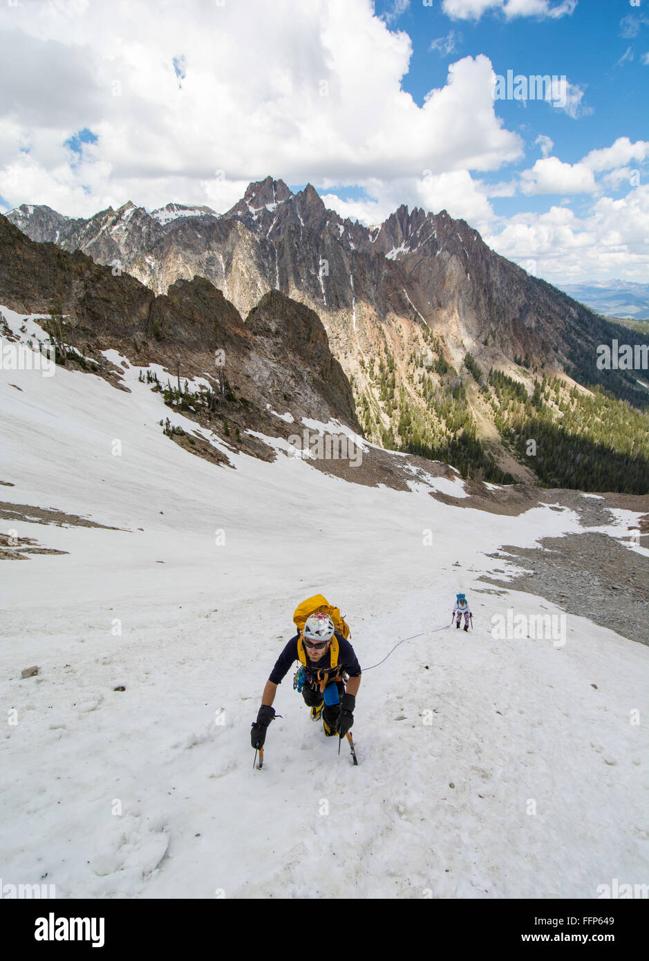 Brandon Prince and Noelle Snyder climbing the 'Sickle Couloir' on Horstmann Peak 10,470ft near Stanley, Idaho Stock Photo