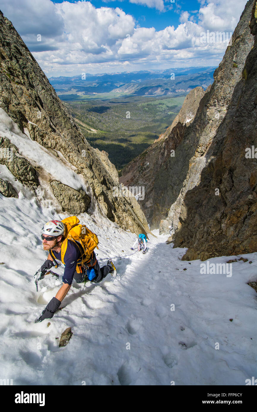 Brandon Prince and Noelle Snyder climbing the 'Sickle Couloir' on Horstmann Peak 10,470ft near Stanley, Idaho Stock Photo