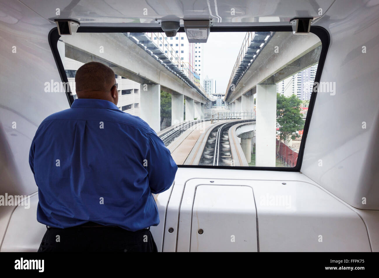 Florida South,Miami,People Mover,free downtown rail shuttle,Black adult,adults,man men male,overweight obese obesity fat heavy plump rotund stout,obes Stock Photo