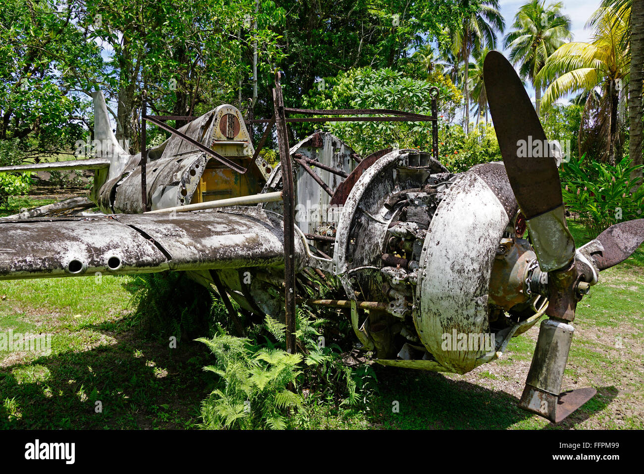 Wreckage of American Grumman Wildcat fighter plane in outdoor Vilu War Museum, Guadalcanal, Solomon Islands. Stock Photo