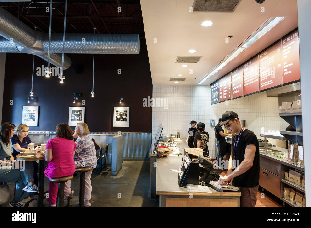 Florida South,Port St. Saint Lucie,Chipotle,restaurant restaurants food dining cafe cafes,Mexican,food,interior inside,counter,cashier,adult,adults,ma Stock Photo