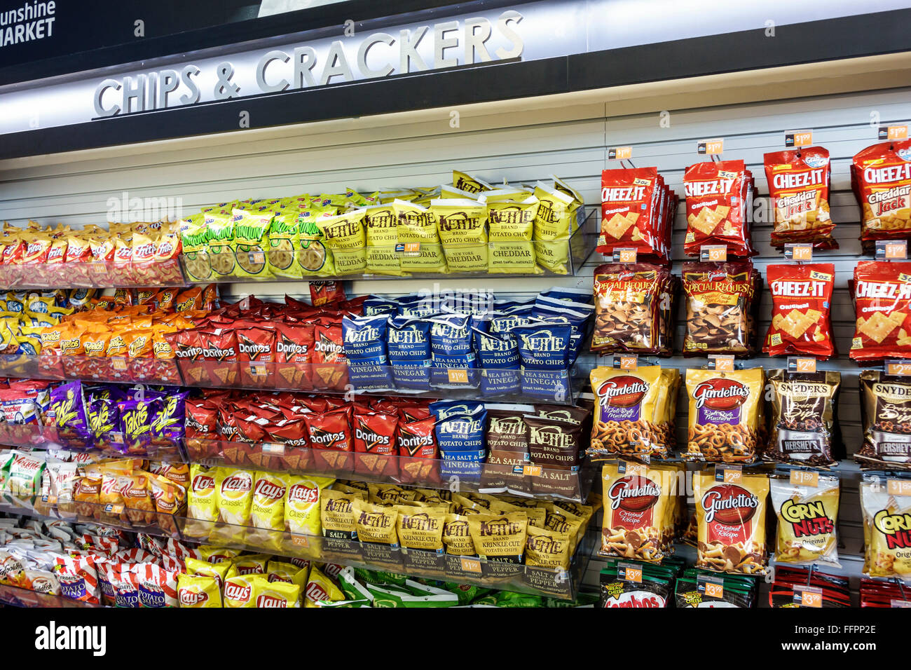 Florida South,Fort Ft. Drum,Turnpike,highway,toll road,rest stop,convenience store,sale,display sale salty snacks,junk food,Pringles,bags,chips,pretze Stock Photo