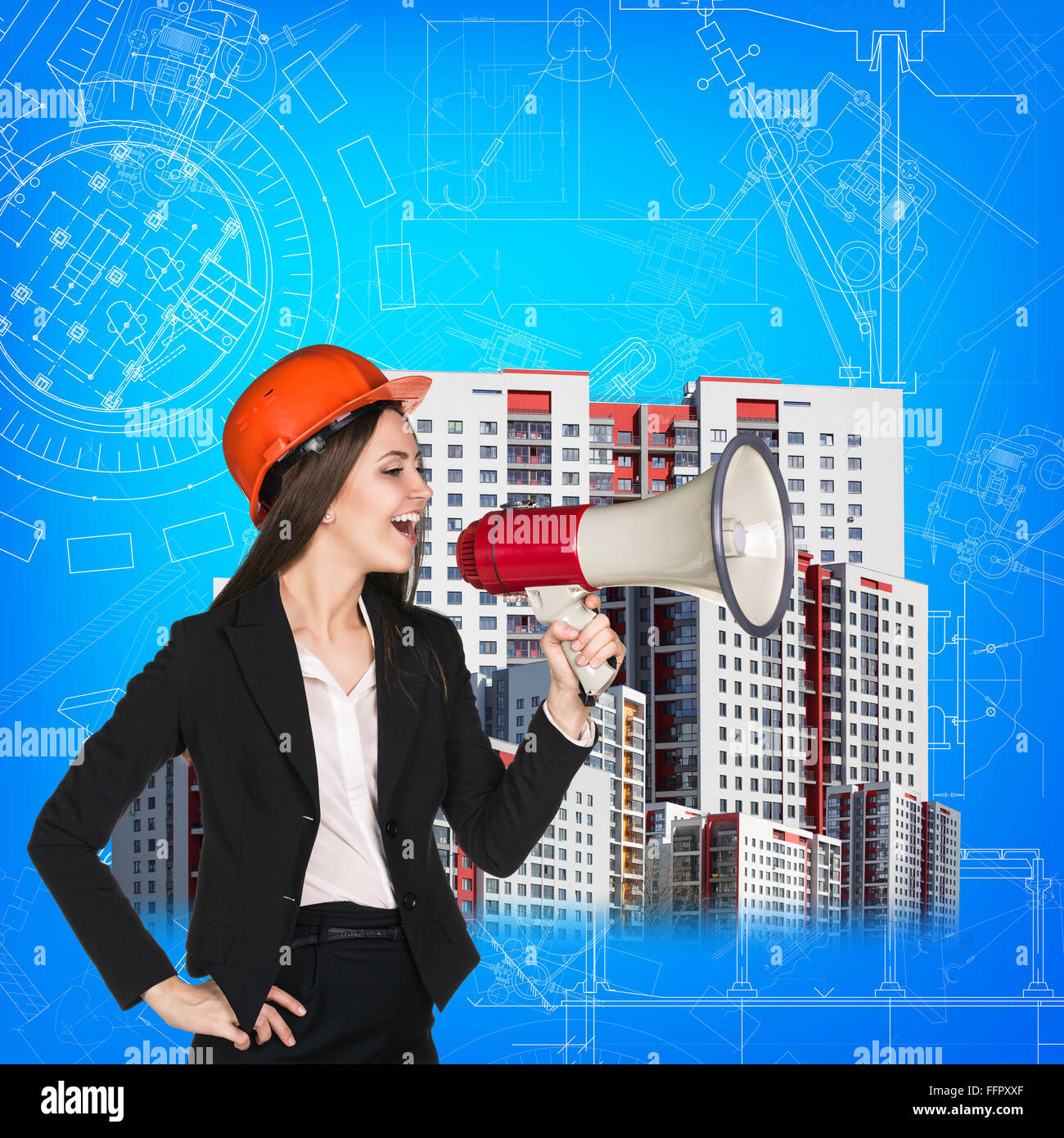 Woman builder stands near buildings on blueprint background Stock Photo