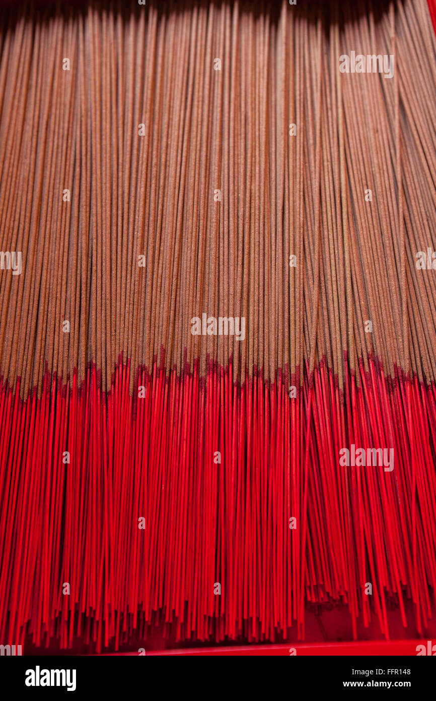 Chinese thin incense/joss sticks layout in order for devotee to use for prayer at a temple in Chinatown, Singapore Stock Photo
