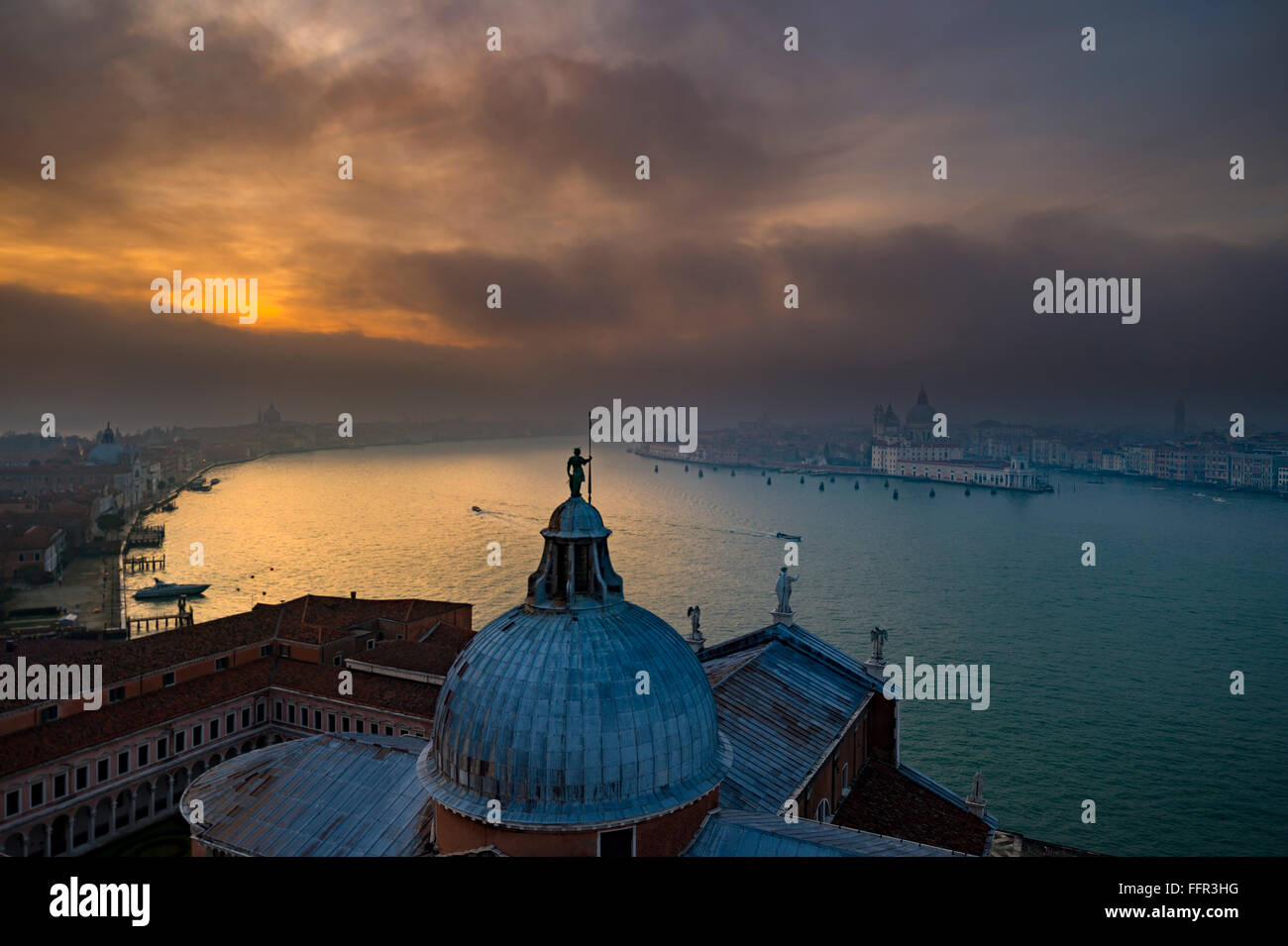 View of Church of San Giorgio Maggiore to Basilica di Santa Maria della Salute at sunset, Venice, Veneto, Italy Stock Photo